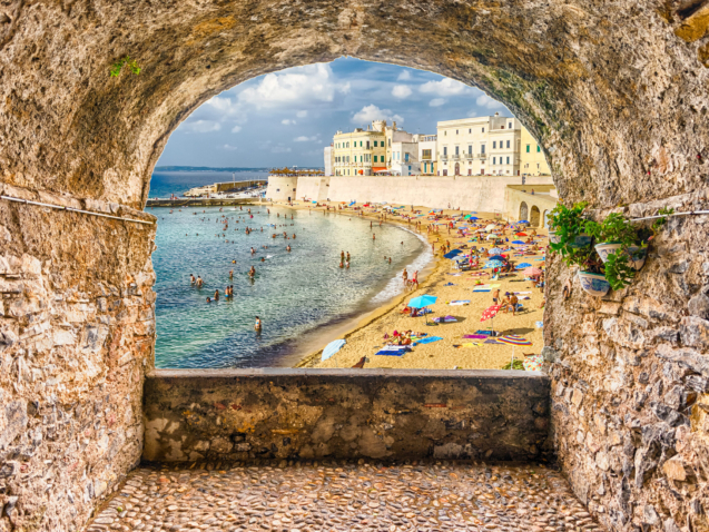 Scenic rock arch balcony overlooking Gallipoli waterfront, Salento, Apulia, Italy